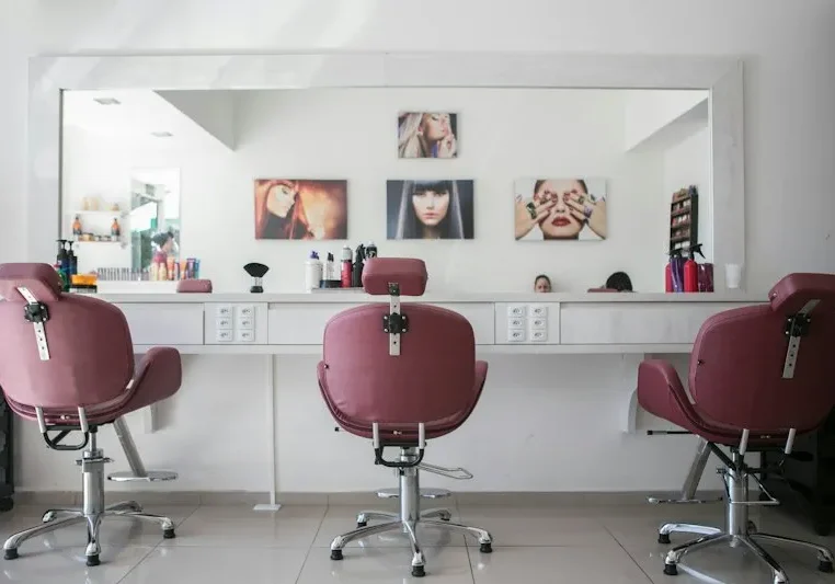 Bright, modern salon interior with mirrors and styling stations